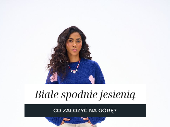 Spodnie w kolorze ecru o szerokiej nogawce zestawione z granatowym swetrem o grubym splocie