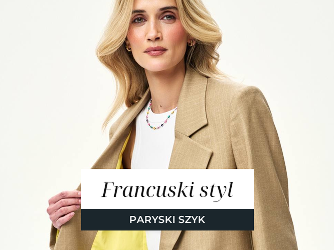 Kobieta w kamelowej marynarce i białym topie w duchu paryskiego szyku, baner artykułu o francuskim stylu ubierania.
