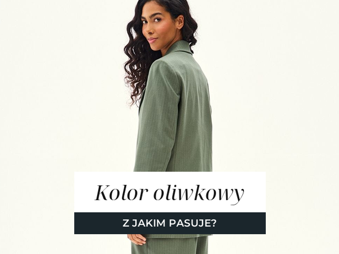 Kobieta w oliwkowym komplecie z marynarką i szerokimi spodniami, jesienna paleta odcieni ziemistych.
