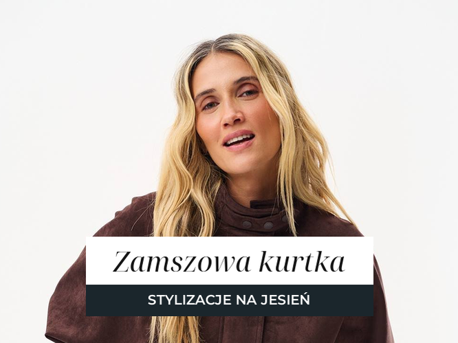 Kobieta w krótkiej zamszowej kurtce w kolorze czekoladowego brązu z paskiem w talii, noszonej do białego topu i brązowych jeansów.